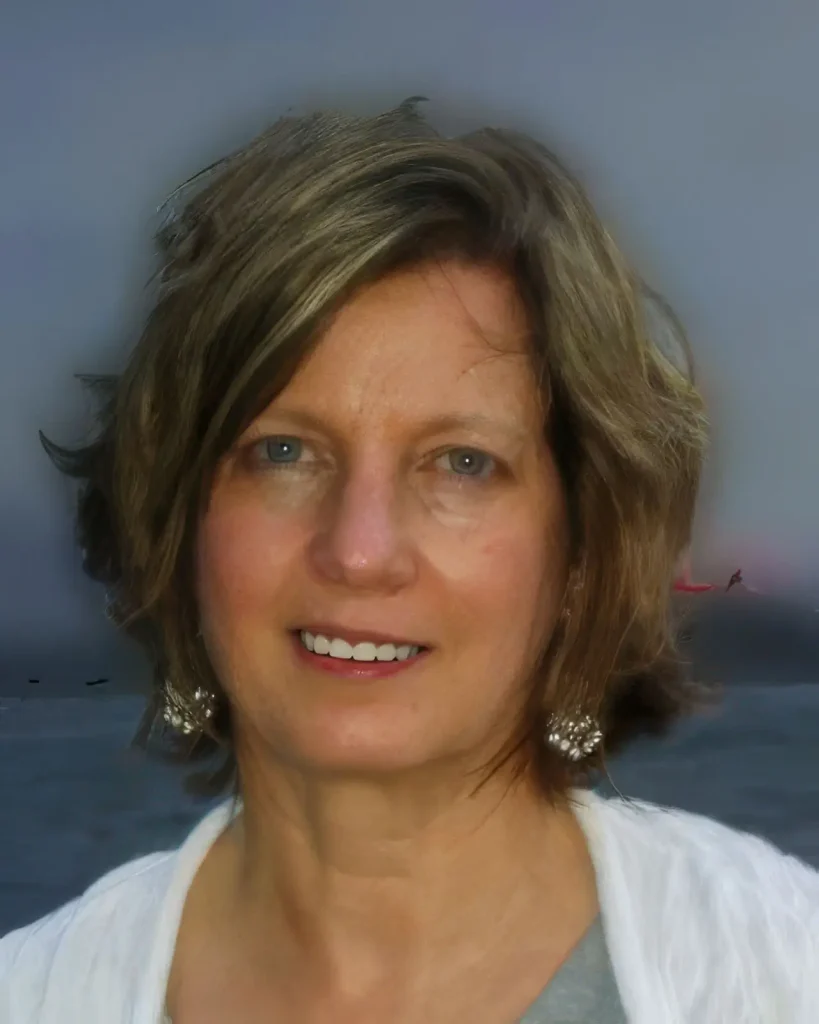 Headshot of Janine Hurley-Nicoll LCSW. The beach is in the background.