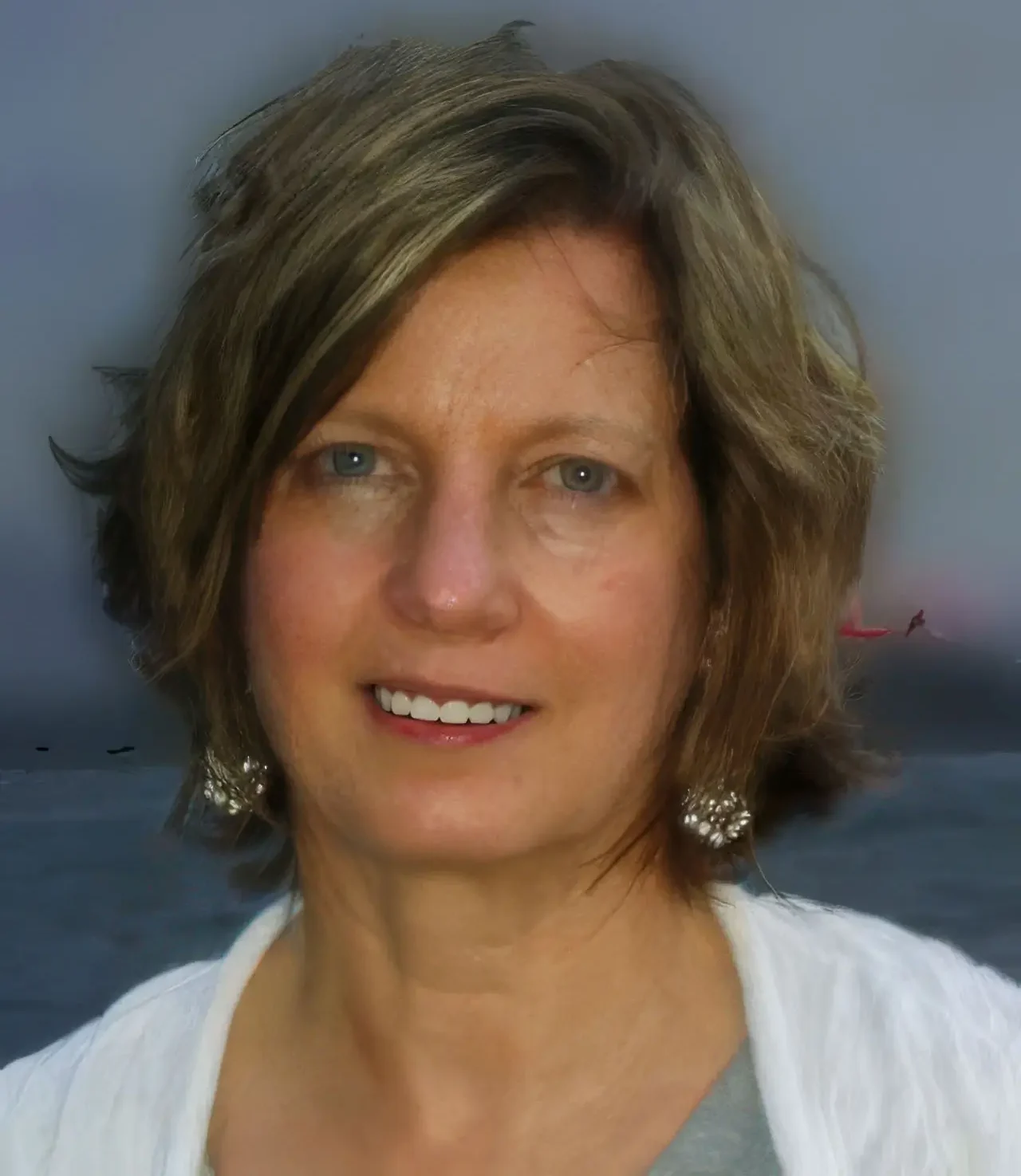 Headshot of Janine Hurley-Nicoll LCSW. The beach is in the background.