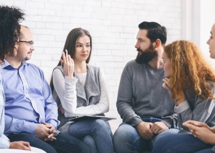A circle of people conversing